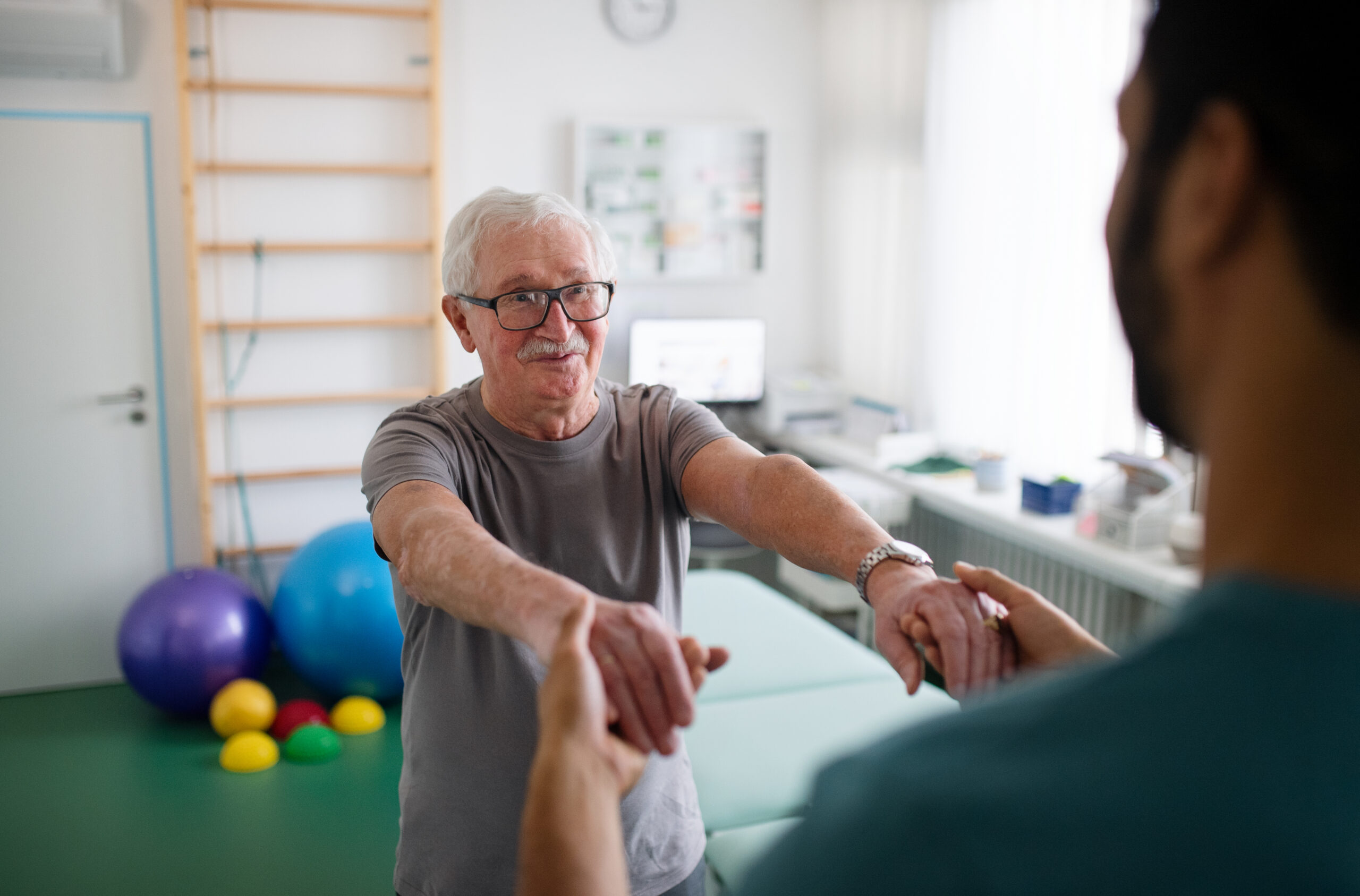 senior man receiving physical therapy at Fracture clinic to understand how bones heal